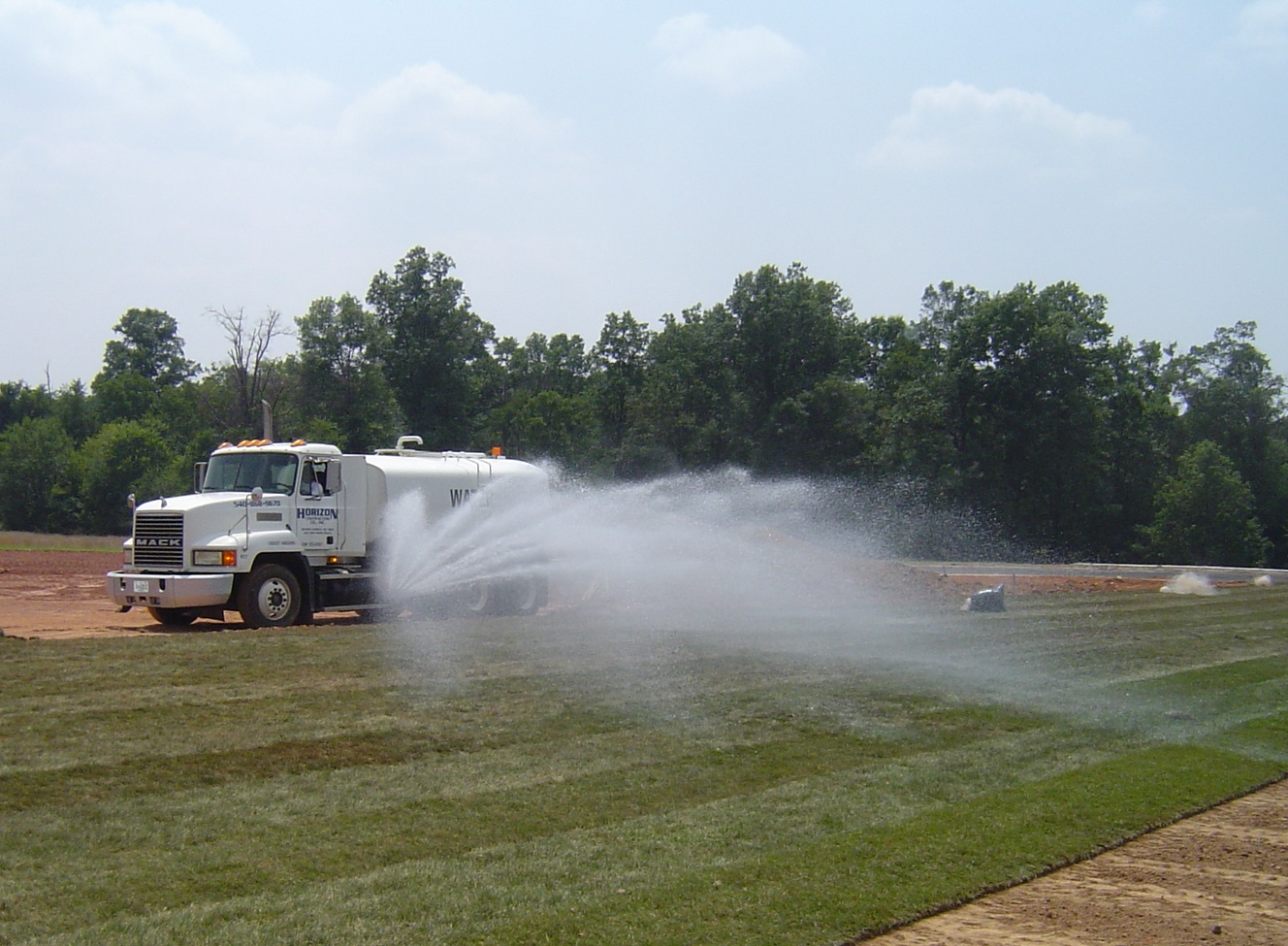 Large Flushtruck watering sod